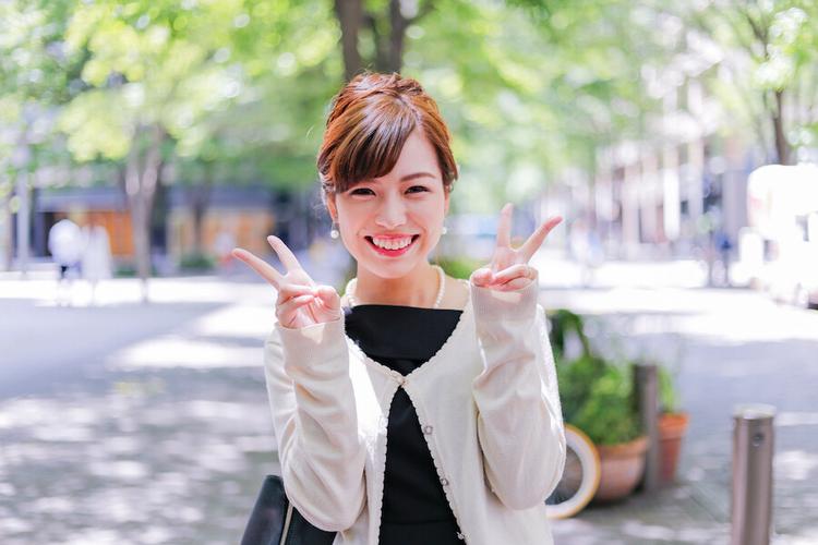 A happy woman in London, smiling after being matched with the perfect man.