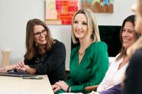 London matchmakers sitting at a table.