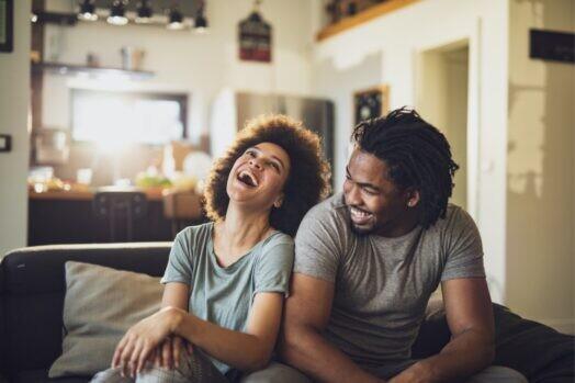 young-cheerful-african-american-couple-in-the-living-room-picture-id1135073129 - cohabiting