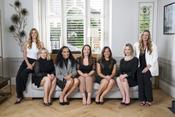 London matchmakers sitting on a sofa