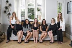 London matchmakers sitting on a sofa