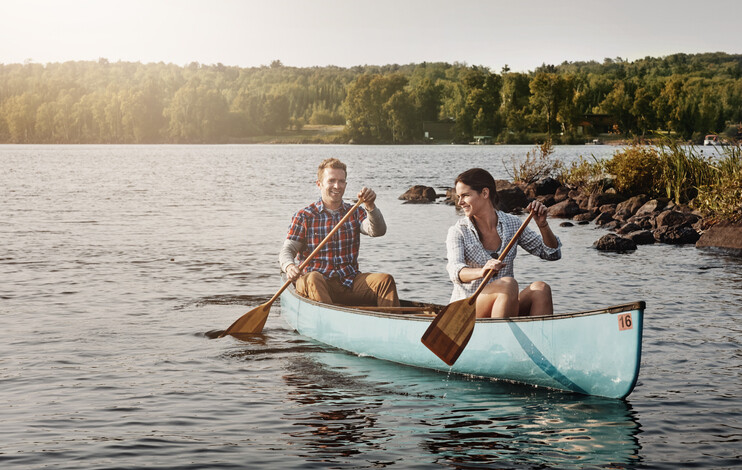 Shot of a young couple going for a canoe ride on the lake